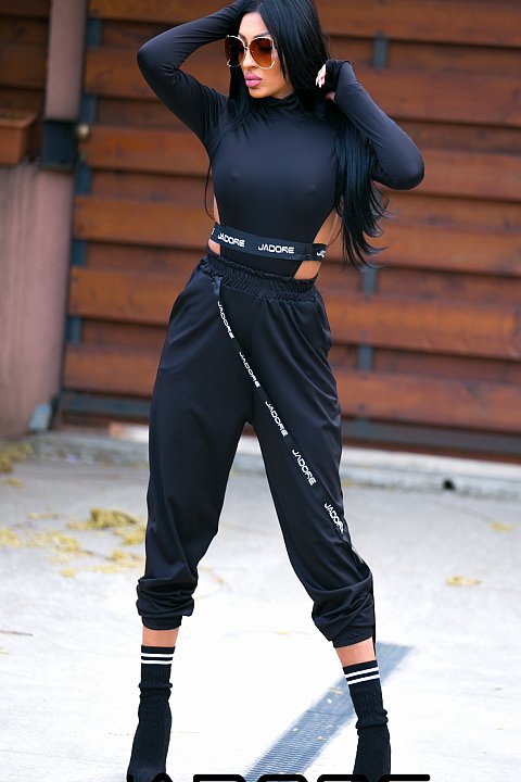 Black sports suit in acetate fabric with body. 