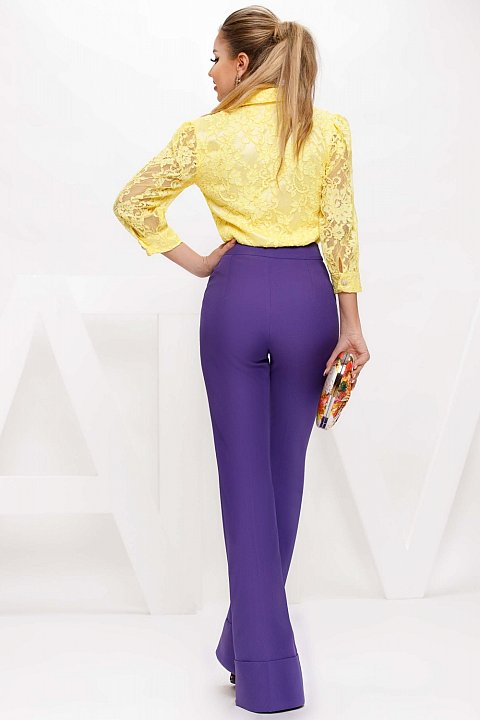 Purple flared cady trousers.