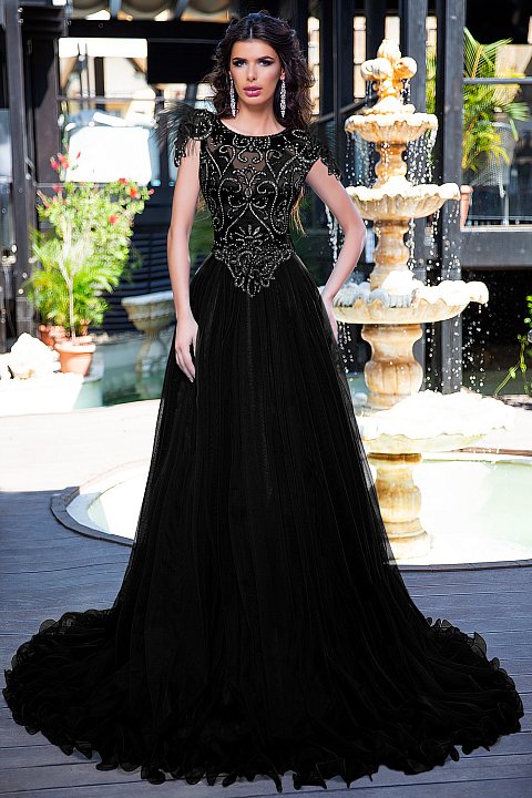 Long black ceremony dress in satin tulle and textured lace. 