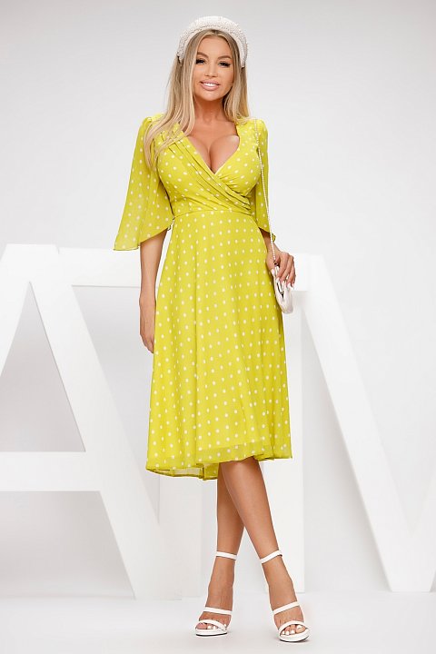 Midi dress in yellow voile with white polka dots.