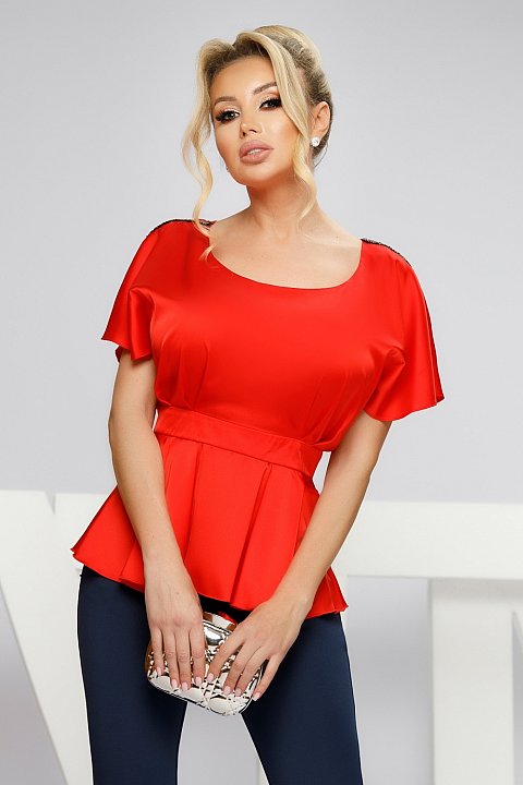 Red satin blouse with decorated shoulders. 