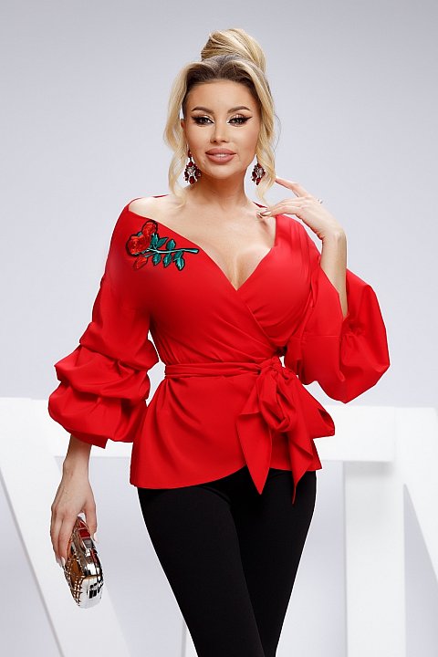 Elegant red shirt with puff sleeves and deep V-neck.