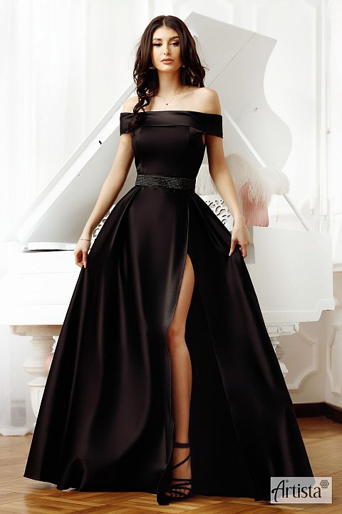 Elegant knee-length dress, black color. Model with wide flounce at the bottom. The bust is a post skin model, with slightly drooping shoulders and a plunging ne