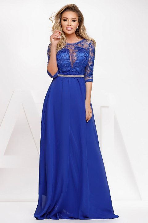 Long blue veil dress with lace insert and rhinestone belt at the waist.