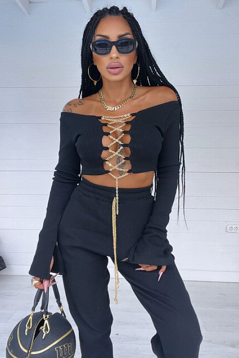 2-piece set, with golden chains, consisting of high-waisted trousers and long-sleeved blouse, up to the waist, very sexy model. Black colour.