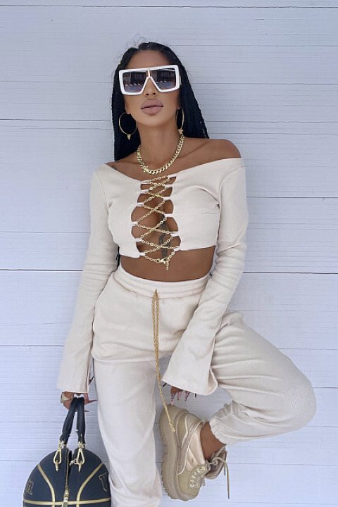 2-piece set, with golden chains, consisting of high-waisted trousers and long-sleeved blouse, up to the waist, very sexy model. Beige.