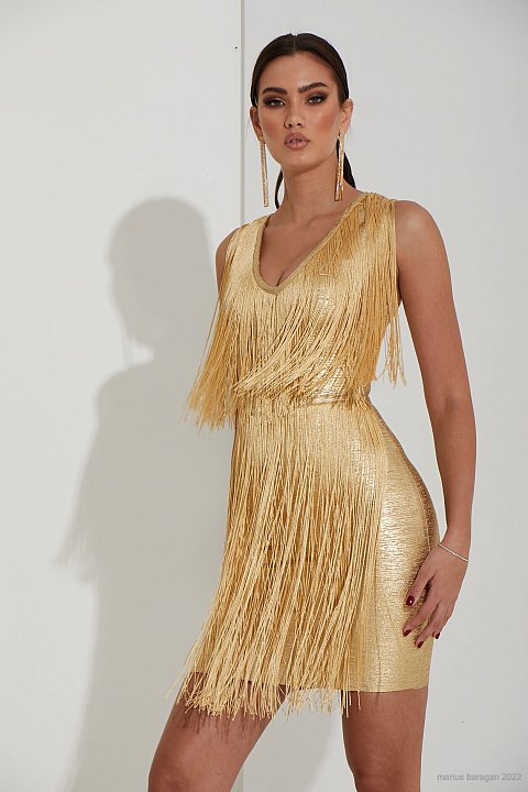 Fitted light gold sheath dress with fringes