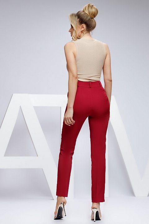 High waisted red tapered trousers.