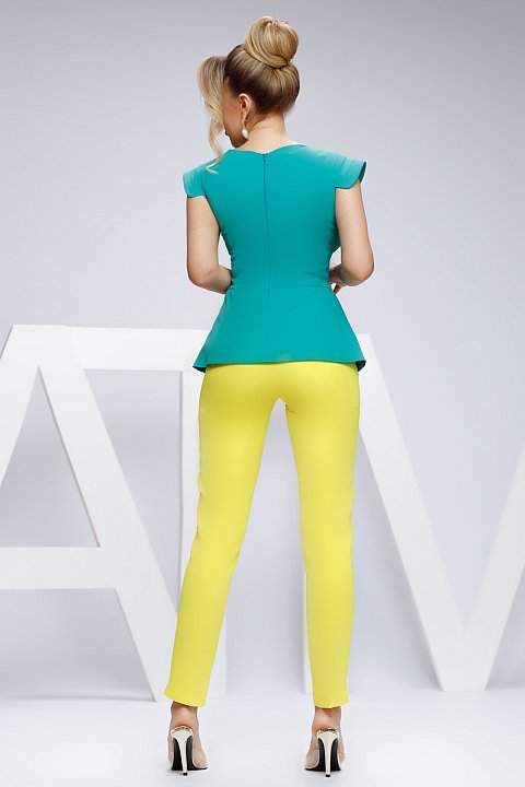 Green blouse with flounces and golden buttons, elegant office model.