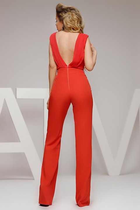 Very sexy coral long jumpsuit with flared pants. The jumpsuit has a lace bust accessorized with rhinestones, and the back is bare, which gives it sheen.