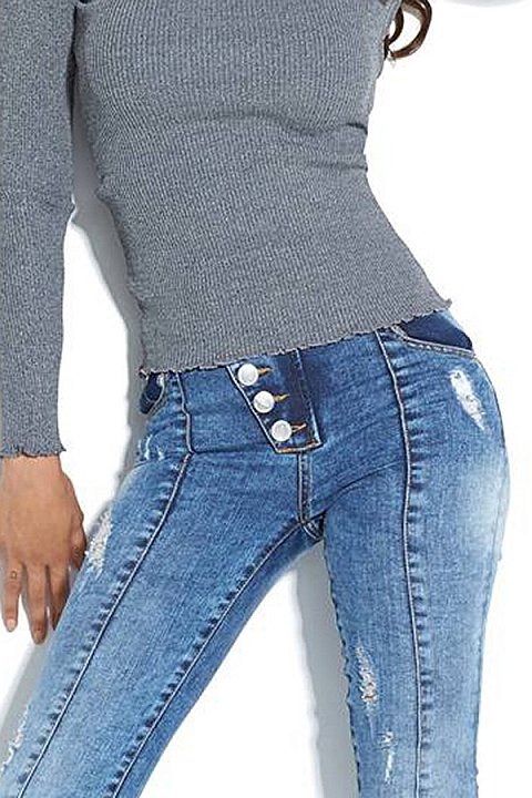 Jeans skinny con strappi e impunture esterne. 