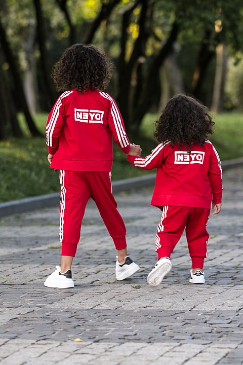 Sports Suit for Girl / boy red with white side bands.