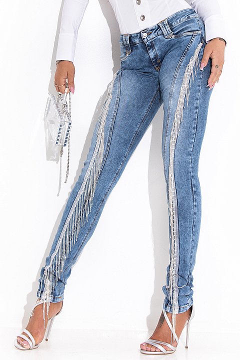 Low waist light blue jeans with rhinestone fringes.