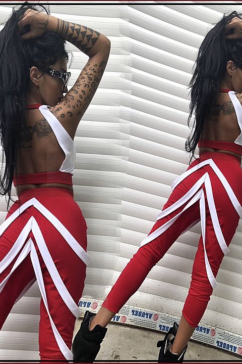 Two-piece sports suit in red with white details.