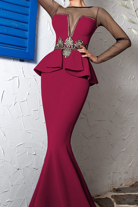 Long evening dress in burgundy color with yoke and sleeves in sheer tulle. 
