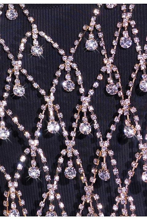 Elegant jewel top composed of shiny golden rhinestone chains