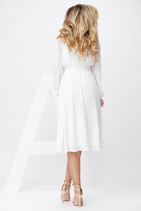 White midi dress with long puff sleeves.