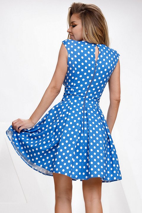Doll dress with white polka dots.