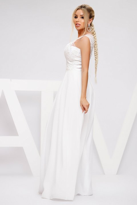 Long white wedding dress with a flowing skirt